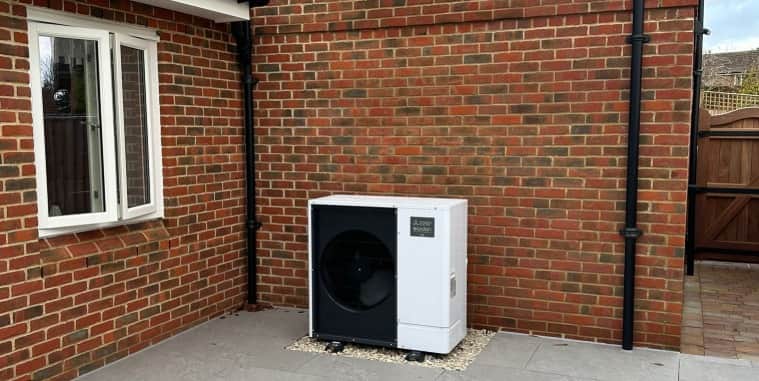 Mitsubishi Ecodan air source heat pump installed on a brick house in Birmingham by Green Glow Insulation